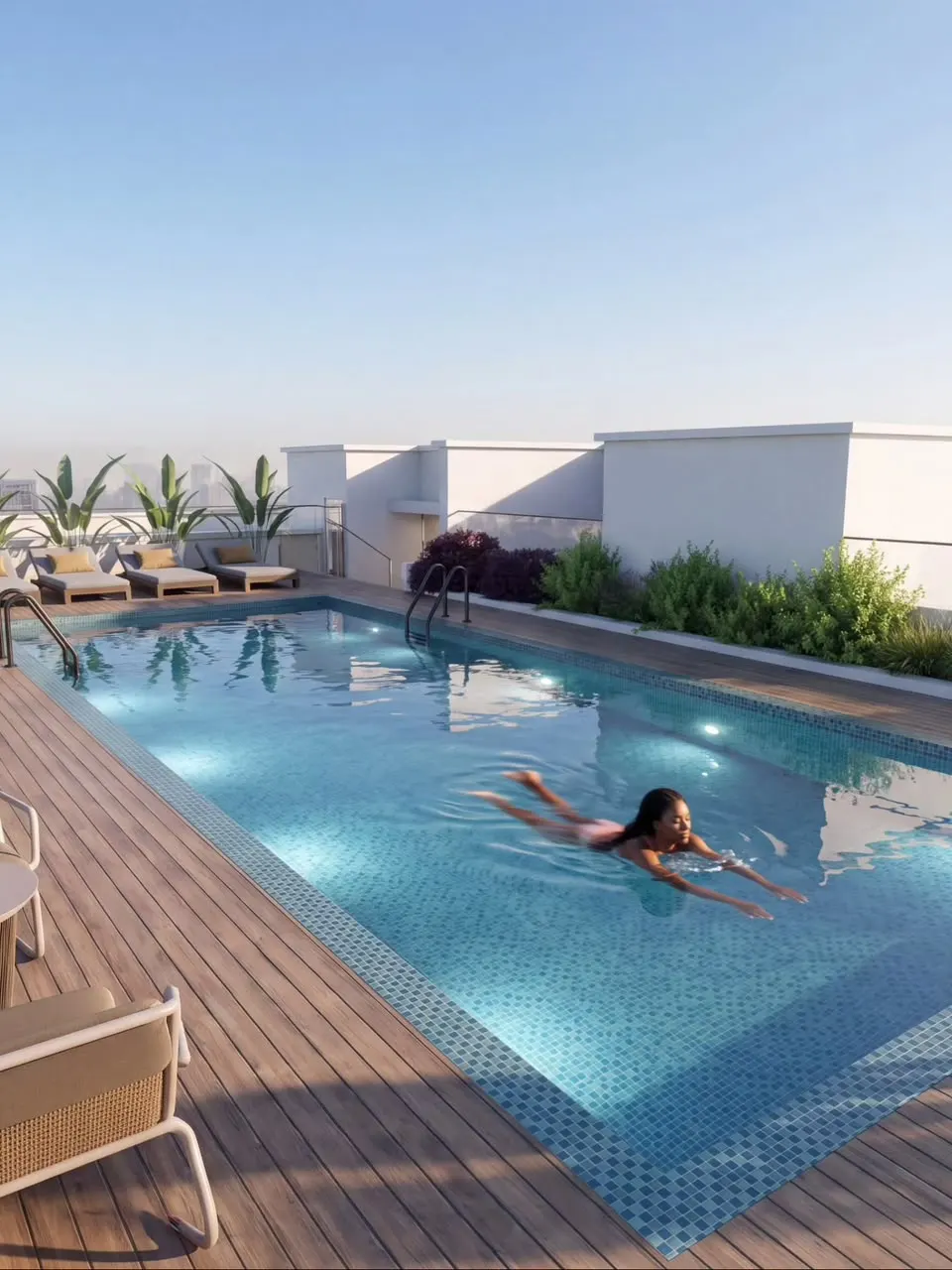 Woman swimming in the GOGLE rooftop pool